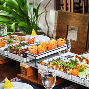 Colorful Indonesian dessert table with various traditional sweets and cakes